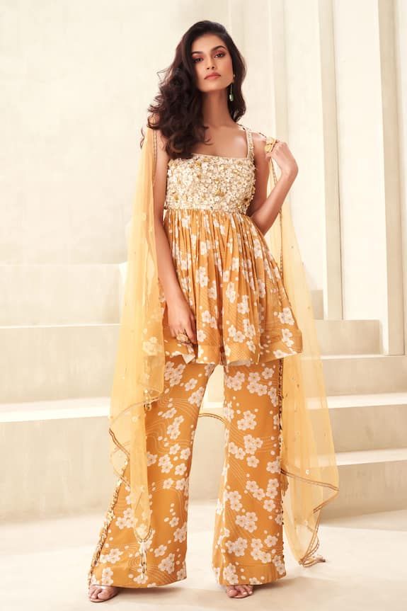 Gold floral print peplum top with floral embroidered yoke and back tie-up. Paired with a flared print pant and embellished dupatta. - Aza Fashions Peplum Top Pattern, Gold Organza, Printed Peplum Top, Print Pant, Floral Squares, Buy Gold, Gold Floral, Pant Set, Printed Pants