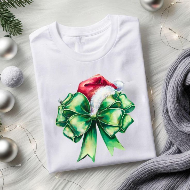 This Coquette Bow T-Shirt brings a festive and stylish vibe to your holiday wardrobe. Perfect for anyone looking to add some holiday cheer to their outfit during the Christmas season. The unisex T-shirt is made from soft and durable ring-spun cotton, making it comfortable to wear all year round. Product features - Made from 100% ring-spun cotton for a lightweight and comfortable feel - Classic fit with crew neckline for versatile styling options - Ethically grown and harvested US cotton for sust Christmas Holiday Crew Neck Shirt, White Christmas T-shirt Gift, Green Holiday Top For Christmas, Green Christmas Holiday Top, Green T-shirt For Christmas Holiday, Green Christmas T-shirt For Holiday, Green Crew Neck Christmas Shirt, White Holiday T-shirt Gift, Christmas Party T-shirt With Graphic Print