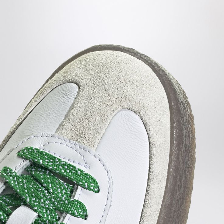 White leather trainer from adidas Originals featuring rounded toe, green side bands, lace-up closure, logoed tongue and natural rubber sole.Leather upper/ Rubber sole Green Leather High-top Sneakers With Gum Sole, Green Leather Skate Shoes With Vulcanized Sole, Sporty Skate Shoes With Gum Sole And Round Toe, Green Leather Lace-up Skate Shoes, Sporty High-top Sneakers With Rubber Sole, Sporty Skate Shoes With Rubber Sole And Round Toe, Sporty Skate Shoes With Rubber Sole, Sporty Custom Sneakers With Round Toe And Laces, Beige Sneakers