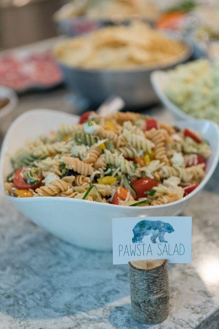 pasta salad in a white bowl on a table