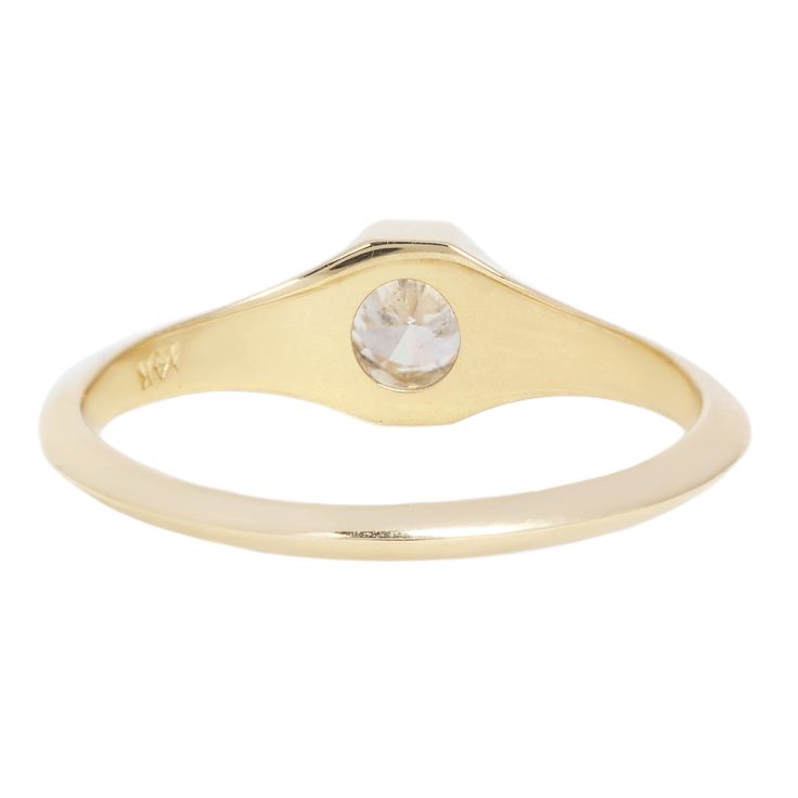 Confident and bold, this solitaire signet ring by WWAKE features a twinkling white antique old European cut diamond. High polish 14k gold frames the stone in a subtle octagonal shape. A flattened knife-edge band allows this stunning signet to stack with other rings. Stones: .25ct White Antique Old European Cut Diamond (Color G/H, VS2) Metal: 14k Yellow GoldMeasurements: Stone length: 4mm, Setting width: 5mm, Setting height: 3.4mm, Band width: 2.9-1.5mm taper Shipping and Delivery: IN STOCK items Timeless Octagon Rose Cut Diamond Ring, 14k Gold Signet Ring With Bezel Setting, Heirloom Octagon Rose Cut Diamond Ring, Timeless Signet Ring With Single Diamond, Timeless Solitaire Signet Ring, Wedding Signet Ring With Bezel Setting And Round Cut, Timeless Round Signet Ring With Single Diamond, Timeless Bezel-set Signet Ring, Timeless Round Solitaire Signet Ring