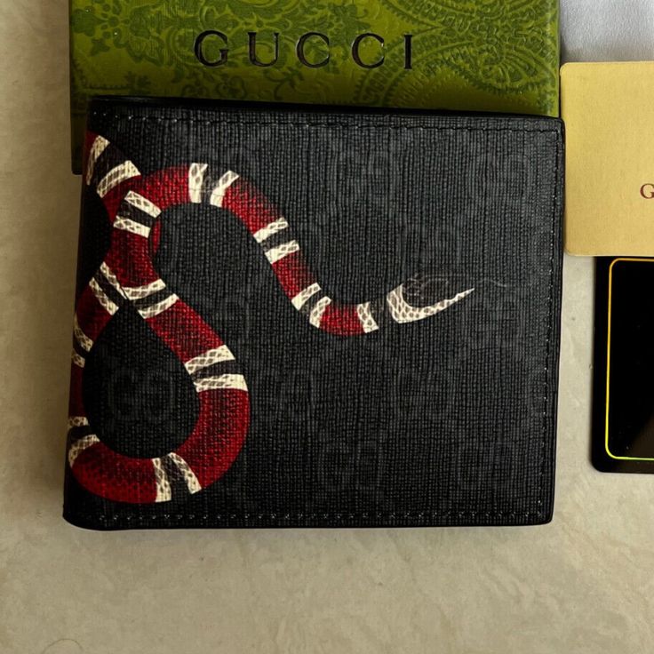 Ships Within 9-12 Days Brand New Gucci Leather Black Bifold Wallet 2 Bill Compartments 8 Credit Cards Pouches Dimension 4.3” X 3.8” Folded If You Need This Classic Leather Wallet Urgently, Please Do Not Buy It Because The Delivery Time For This Is 9-12 Days Gucci Rectangular Wallet With Rfid Blocking, Designer Gucci Wallet With Rfid Blocking, Gucci Luxury Wallets With Rfid Blocking, Gucci Luxury Wallet With Rfid Blocking, Luxury Gucci Wallet With Rfid Blocking, Gucci Leather Wallets With Rfid Blocking, Gucci Leather Wallet With Rfid Blocking, Gucci Men Bag, Designer Black Bifold Wallet