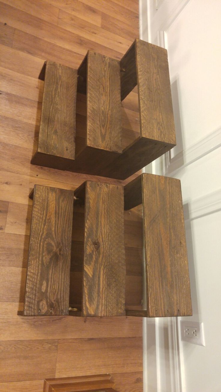 a wooden shelf sitting on top of a hard wood floor