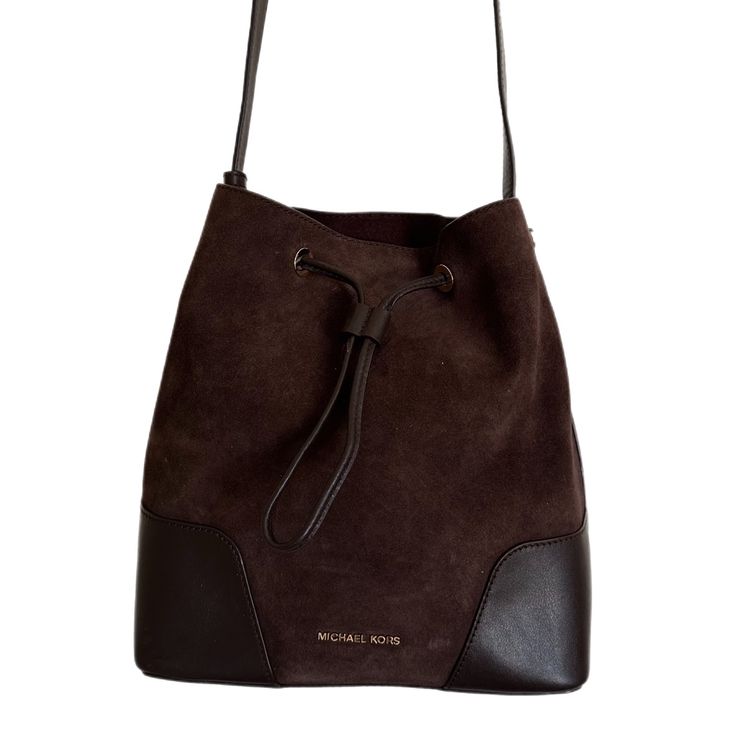 A Michael Kors Bucket Bag From The Cary Collection Crafted In Suede And Smooth Leather And Gold Hardware. This Bucket Bag Features 1 Main Compartment, Drawstring Closure, A Zip Pouch With Pocket, And An Adjustable Strap With A 18"-20.5" Drop. Dimensions: 10.5"W X 11.25"H X 5.75"D. Brand New, Never Been Used. Perfect Condition. Michael Kors Rectangular Bag With Leather Lining, Michael Kors Pouch Shoulder Bag For Everyday Use, Michael Kors Leather Lined Everyday Shoulder Bag, Chic Michael Kors Bag With Leather Lining, Michael Kors Cognac Shoulder Bag For Everyday Use, Michael Kors Shoulder Bag With Leather Lining, Elegant Michael Kors Bucket Bag For Travel, Michael Kors Bucket Bag For Travel, Michael Kors Bucket Shoulder Bag For Errands