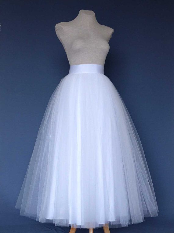 White Tulle Skirt . Wedding tulle skirt .Tea length tulle skirt. Tutu skirt woman. Bridal tutu skirt Wedding Tea Length Dress With Tulle Skirt, White Tulle Tutu Dress For Wedding, Elegant Tutu Dress With Tulle Skirt For Wedding, Voluminous Tulle Skirt For Wedding, Wedding Tutu Dress With Fitted Tulle, Long Tulle Skirt For Wedding, White Organza Tutu Dress With Tulle Skirt, Long Tulle Wedding Skirt, Fitted Tulle Tutu Dress For Wedding