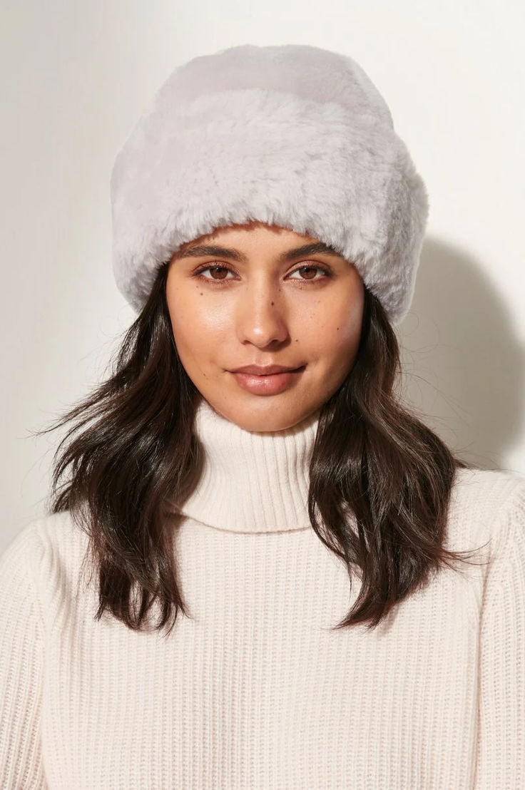 Conquer the winter chill with this timelessly stylish and incomparably warm winter hat. Made of dense, silky mouton shearling sheepskin, this elegant hat lends luxurious warmth to your winter wardrobe, while giving you a classic look from day to night. The rolled brim allows you to adjust over your ears, while satiny polyester lining ensures a nice fit. Frame your face in luxury! Cossack Hat, Hats Cowboy, Elegant Hat, Sheepskin Gloves, Crochet Winter Hats, Fur Hats, Stylish Scarves, Warm Winter Hats, Elegant Hats