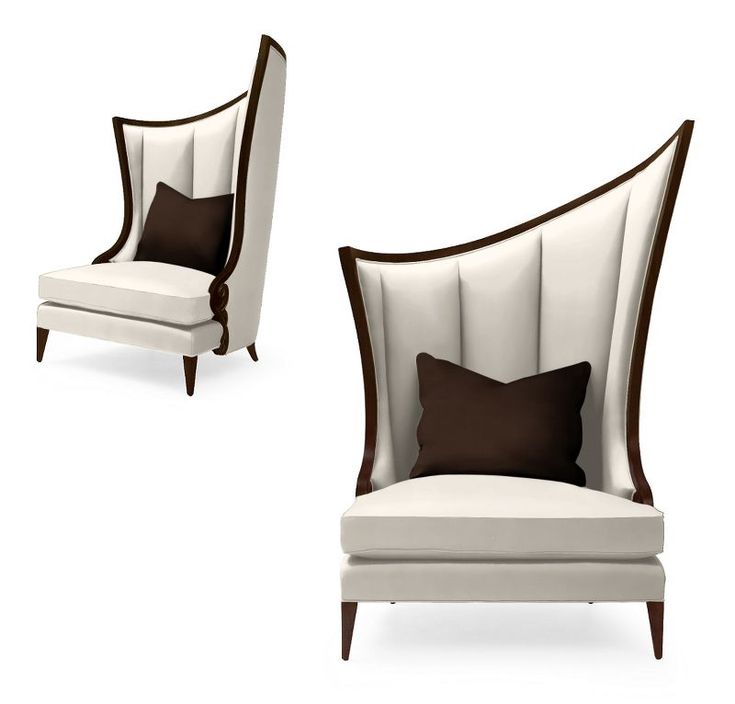 two white and brown chairs with pillows on top of each chair, one in the shape of a wingback