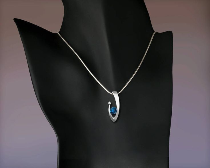 "London Blue Topaz and White Sapphire Necklace - Argentium Silver - 3418 - Argentium chain Included Make a statement with this contemporary design handcrafted by award winning designer, David Worcester. ( IMPORTANT - PLEASE READ 1. AND 2 BELOW ) 1.) INCLUDED IN THE PRICE IS AN ARGENTIUM SILVER CHAIN APPROPRIATE FOR THE PENDANT CHOSEN. YOU CAN CHOOSE FROM 16\", 18\" OR 20\" AT CHECKOUT. 2.) PLEASE LOOK AT THE MEASUREMENTS CAREFULLY. SOME PHOTOS HAVE BEEN ENLARGED TO SHOW DETAIL, WHILE OTHERS HAVE Modern Topaz Birthstone Jewelry, Modern White Gold Topaz Jewelry, Modern Blue Pendant Jewelry, Modern Sterling Silver Necklace With Diamond Cut, Fine Jewelry Pendant Necklace With Tension Setting, Formal Blue Topaz Teardrop Pendant Necklace, Elegant Blue Topaz Birthstone Necklace For Anniversary, Modern Blue Diamond Necklace, Modern Oval Pendant Jewelry For Anniversary