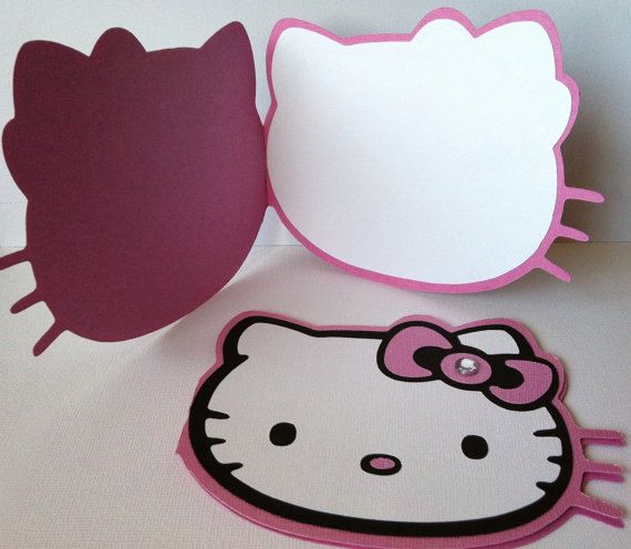 an image of hello kitty cut outs on the table