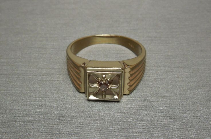 Vintage Circa 1960 Constructed of 14KT White & Yellow Gold Containing 1 Genuine Earth-Mined Round Brilliant cut Natural Fancy Cognac Colored Diamond weighing approximately 0.12 carats Diamond measuring approximately 2.8mm in diameter I2 Clarity Secured in a 4-Prong Starburst Style 14KT White Gold Square Illusion section Top section of ring measuring 10mm in length & about 5mm high when on the finger *Refer to photo of face of ring next to U.S. DIME for size reference.. Inside shank: 14K Vintage White Gold Signet Ring With Center Stone, Antique Single Diamond Jewelry For Formal Occasions, Vintage Yellow Gold Diamond Ring For Formal Occasions, Vintage Yellow Gold Signet Ring With Center Stone, Vintage 14k Gold Signet Ring With Center Stone, Vintage Gold Signet Ring With Single Diamond, Vintage Gold Engraved Ring With Single Diamond, Vintage Rectangular Rings With Brilliant Cut, Vintage Rectangular Brilliant Cut Rings