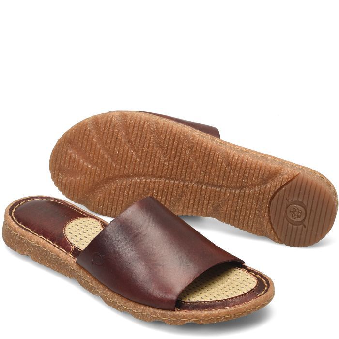 Playa Basic | Born Shoes Brown Slides With Cork-bed Midsoles And Single Toe Strap, Comfortable Natural Leather Sandals, Beach Mules In Natural Leather, Adjustable Brown Slides For Beach, Beach Leather Mules In Natural Color, Leather Slide Sandals For Beach, Natural Leather Mules For Vacation, Natural Leather Mules For Casual Wear, Comfortable Leather Beach Mules