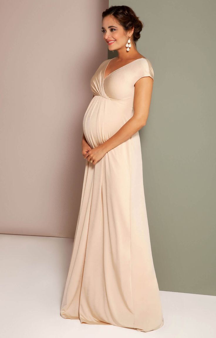 Introducing our bestselling Francesca Dress in a dreamy new Champagne hue. Sleek and elegant, this ever-popular style is designed in a luxurious soft-sheen jersey that glides effortlessly over pregnancy curves, whatever stage you’re at. Available in both long and short lengths, the perfect style for expecting brides looking for an alternative to white, bridesmaids with a bump and for baby showers too. Champagne luxe jersey with subtle sheen Flattering cross-over neckline Stretch for comfort Floa Maternity Dress For Wedding Guest Nordstrom, Pregnant Bride Dress Chic Bump Club, Cheap Elegant Maternity Dress For Summer, Luxury Floor-length Maternity Maxi Dress, Pregnancy Gowns Dresses Chic Bump Club, Evening Maternity Dresses Parties, Luxury Full-length Sleek Maxi Dress, Maternity Cocktail Dress Maxi, Formal Maternity Dress Maxi