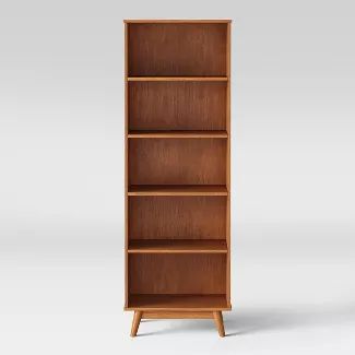 an empty wooden bookcase on a white background