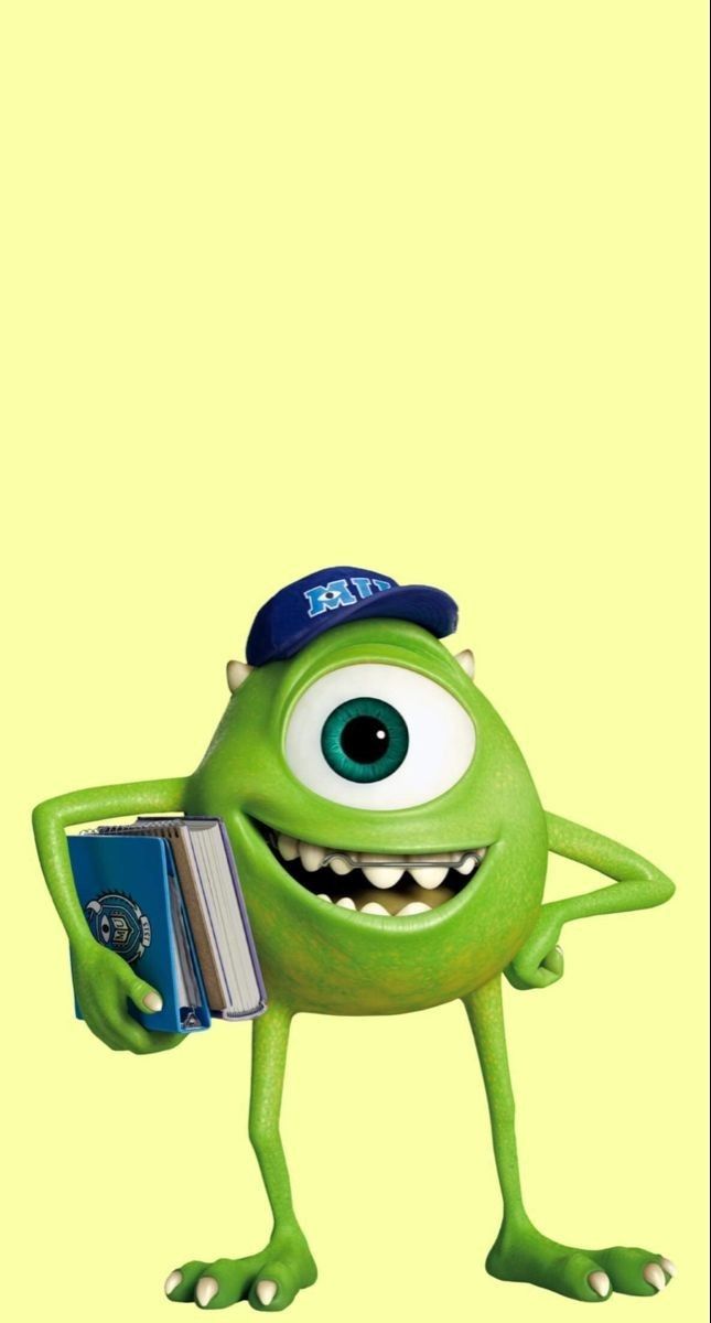 a green monster holding a book and wearing a hat with his hands in the air