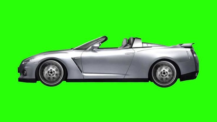 a silver sports car driving on a green screen