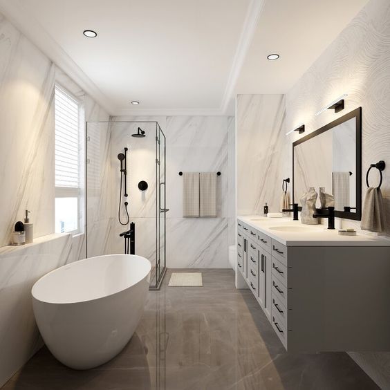 a large bathroom with marble walls and flooring is pictured in this image, there are two sinks on either side of the bathtub