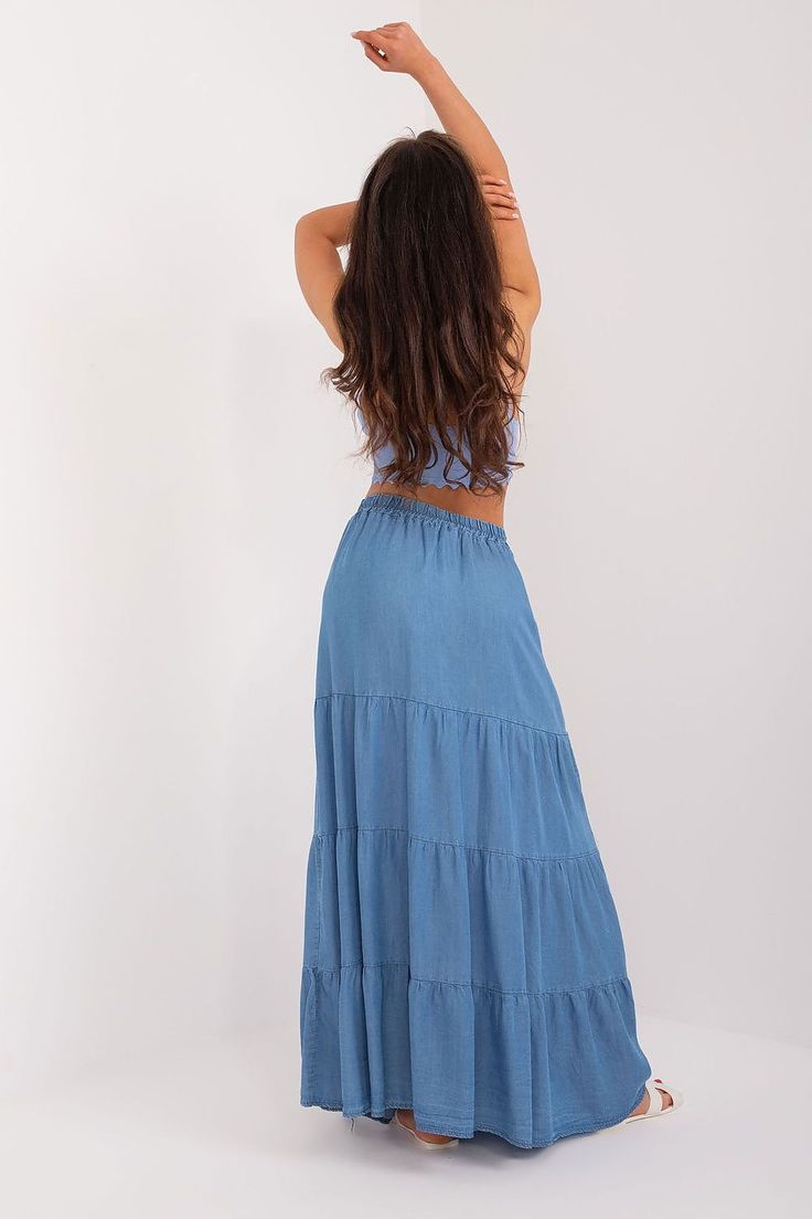 The casual long skirt is an excellent choice for everyday occasions, as well as for work. Its main asset is the smooth, minimalist design, which adds elegance and subtlety. Made mainly of tencel, the skirt provides not only a stylish look, but also comfortable to wear and durable material. Its midi length makes it suitable for both formal meetings at work and informal after-hours outings. No matter the occasion, this skirt fits perfectly into a casual yet professional style. ~Tencel 100 % Size C Rayon Maxi Skirt For Day Out, Blue Rayon Maxi Skirt, Blue Rayon Maxi Skirt For Spring, Beach Maxi Skirt In Solid Color, Spring Rayon Maxi Skirt, Blue Flowy Rayon Maxi Skirt, Solid Rayon Skirt For Summer, Solid Rayon Lined Maxi Skirt, Beach Tiered Maxi Skirt In Solid Color