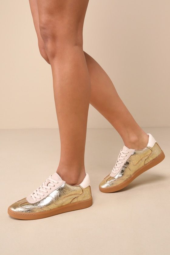 Metallic Sneakers With Perforations And Round Toe, Metallic Sneakers With Perforations, Gold Leather Sneakers With Gum Sole, Gold Leather Low-top Sneakers, Gold Leather Sporty Sneakers, Gold Leather Sneakers With Rubber Sole, Metallic Leather Lace-up Sneakers, Gold Sneakers With Gum Sole And Round Toe, Gold Low-top Sneakers With Textured Sole