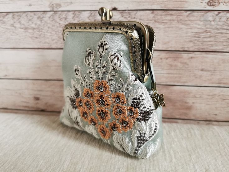 Double Kiss lock Coin Purse, vintage style wallet, Double Pockets Coin Purse, retro style Kiss clasp Coin Pouch, handmade gift for her Coin purse /kiss lock wallet Features: Measures: 3" (8cm) width top 4" (10 cm) width bottom 4" (10 cm) Height 1" 1/2(3,5 cm) Depth This coin purse is hand sewed by me. The fabric is really unique and particular The metal frame is in bronze vintage-style. No glue is used. I sew the metal frame with the fabric. The double pockets make everything well organized. Eac Vintage Coin Purse With Zipper, Vintage Zipper Coin Purse, Vintage Zipper Coin Purse For Everyday Use, Vintage Everyday Coin Purse With Zipper, Handmade Retro Pouch Coin Purse, Retro Handmade Pouch Coin Purse, Retro Pouch Coin Purse, Vintage Handmade Coin Purse For Weddings, Vintage Clutch Coin Purse