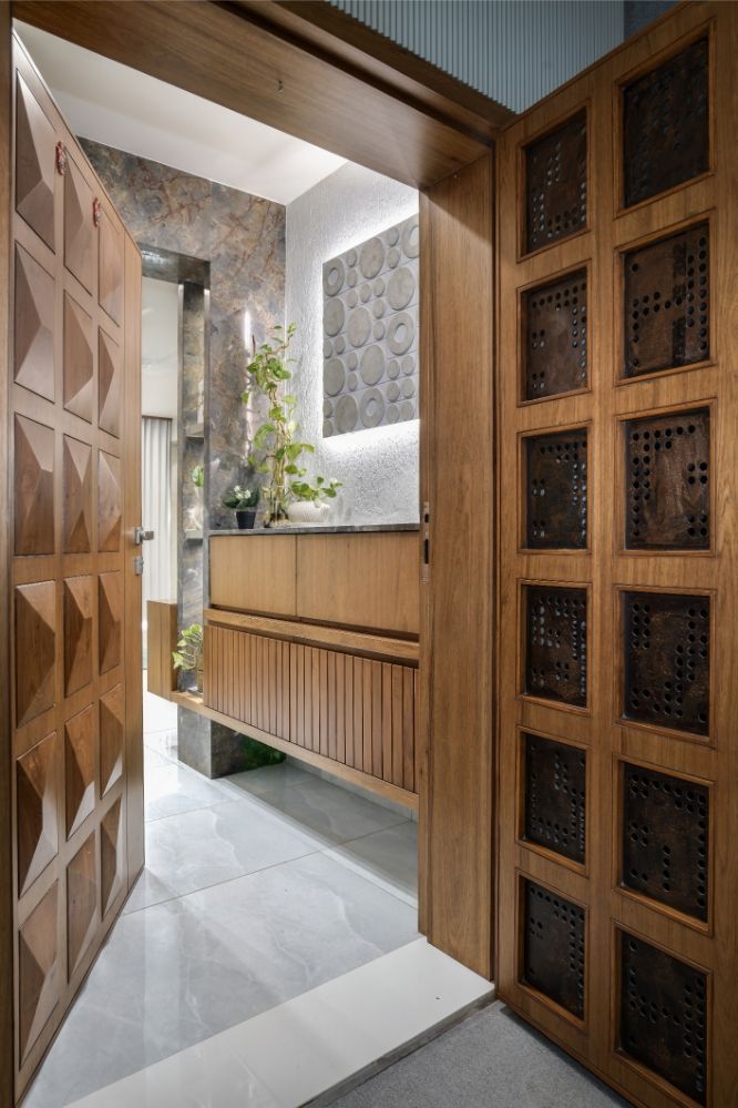 an open wooden door leading to a bathroom