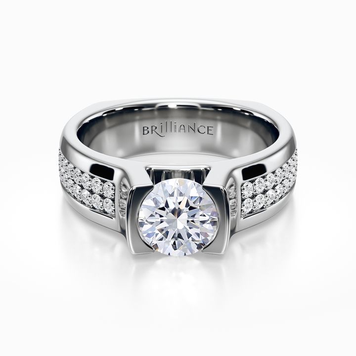 a white gold engagement ring with diamonds on the side and an inscription that reads brilliant