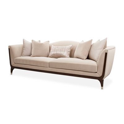 an image of a couch with pillows on the top and bottom part, in front of a white background