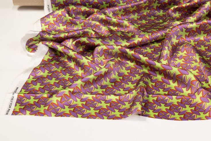 Experience elegance with our luxurious Italian silk charmeuse fabric. Soft and with a light, fluid drape, this fabric is perfect for any special occasion. The unique and vibrant print adds a touch of originality, making a statement piece for any wardrobe. Charmeuse Fabric, Retro Print, Silk Charmeuse, Retro Prints, Green And Purple, Statement Pieces, Special Occasion, Silk, House Styles