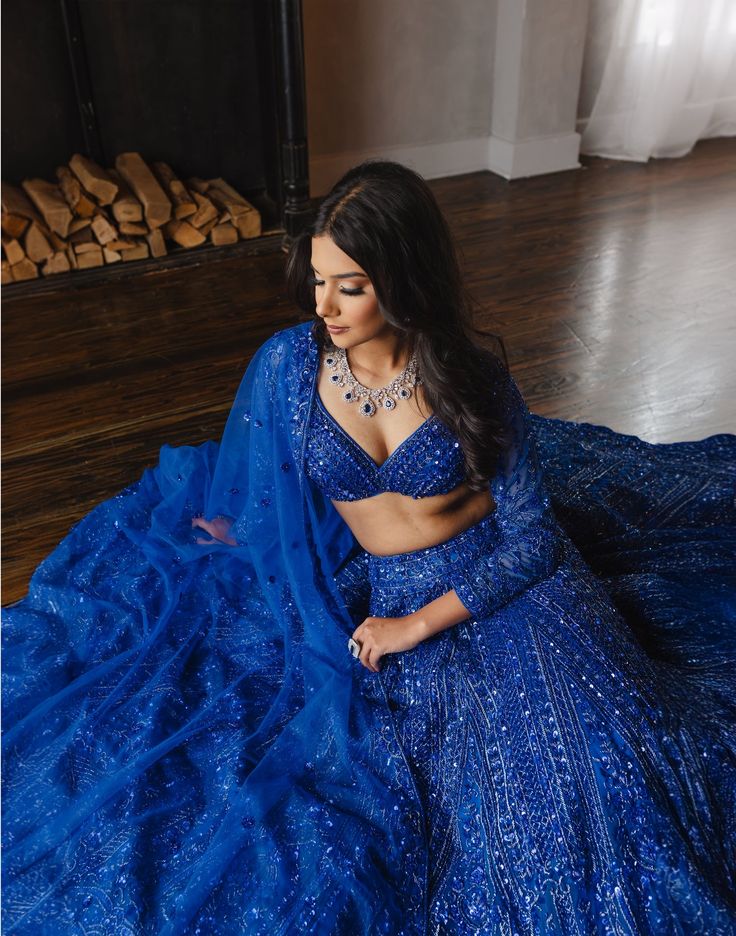 Featuring Fida, a beautiful electric blue hand-embroidered lehenga with a full sleeved blouse and matching dupatta. DELIVERY TIMEPlease allow 1 week for your order to be dispatched. FABRIC DETAILSNet Professional cleaning only. Blue Bollywood Gown With Intricate Embroidery, Blue Saree Gown With Intricate Embroidery, Blue Gown With Sheer Dupatta For Navratri, Royal Blue Dupatta With Intricate Embroidery For Party, Traditional Blue Gown With Sheer Dupatta, Bollywood Style Blue Gown With Sheer Dupatta, Festive Blue Gown With Sheer Dupatta, Blue Bollywood Gown With Traditional Drape, Blue Bollywood Designer Gown