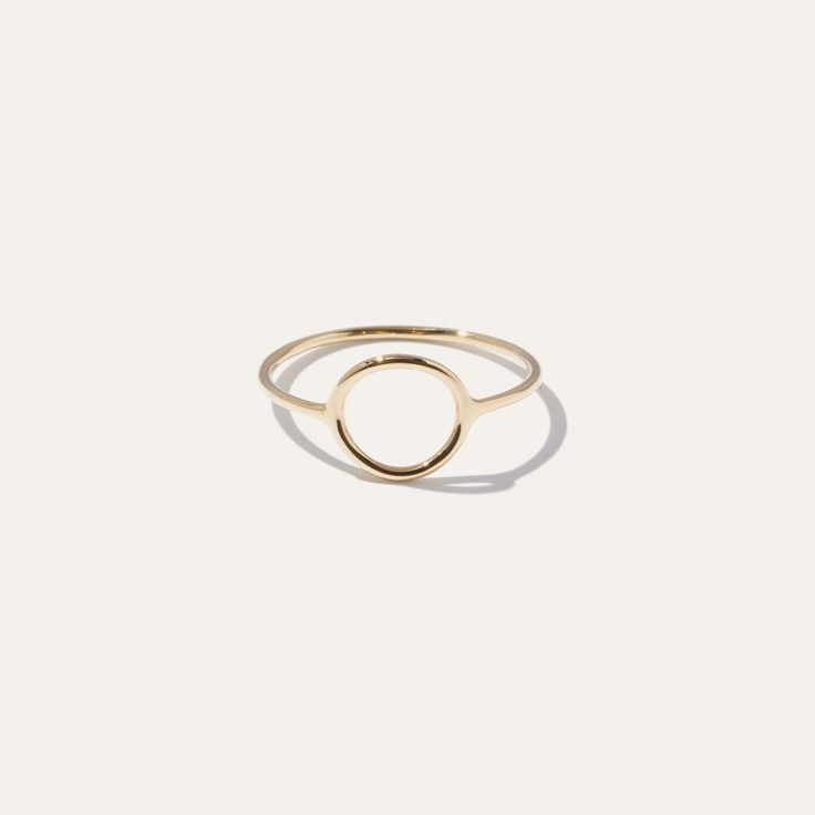 This sleek gold circle ring brings an artful accent to everyday style. Bold enough to wear by itself and minimal enough to compliment a handful of stacked rings. Made in 14k solid gold to stand the test of time. | Women's 14k Circle Ring in Yellow Gold Size 4 | 14k Gold | Quince | Quince | Women's 14k Circle Ring in Yellow Gold, Size 4, 14k Gold Yellow Gold Initial Ring For Everyday, Simple Yellow Gold Initial Ring For Everyday, Everyday Yellow Gold Initial Ring, Timeless Everyday Initial Ring, 14k Gold Timeless Midi Rings For Everyday, Timeless 14k Gold Midi Rings For Everyday, Timeless 14k Gold Round Midi Rings, Timeless 14k Gold Midi Rings, Modern Everyday Stackable Rings With Round Band