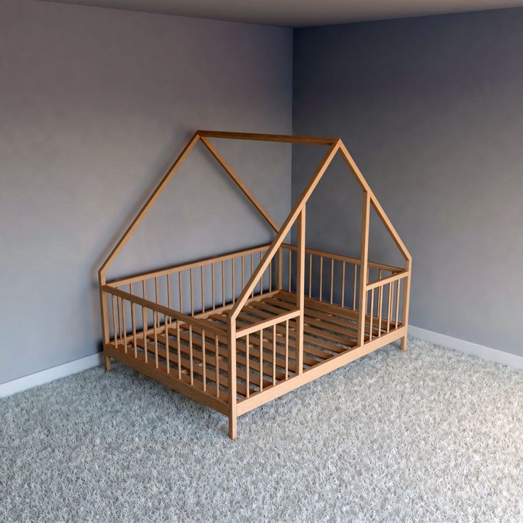 a wooden bed frame with a house shaped top