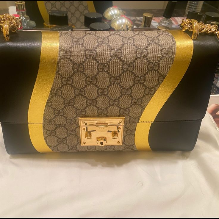 Gucci Black/Metallic Gold Leather Gg Supreme Canvas Large Padlock Shoulder Bag. Only Wore Twice Basically Looks Brand New, Comes With Dust Bag. Negotiable Luxury Gold Shoulder Bag With Lock, Designer Gold Bag With Lock, Gucci Leather Bags With Lock, Designer Gucci Bag With Lock, Luxury Gucci Bag With Lock, Gold Gucci Bag For Formal Occasions, Gucci Gold Top Handle Shoulder Bag, Gucci Rectangular Gold Bag, Gucci Gold Rectangular Bag