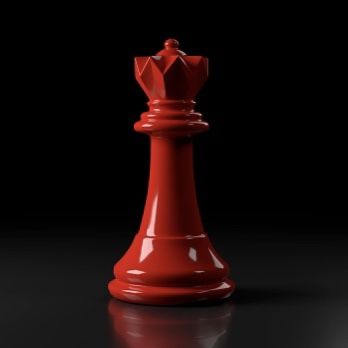 a red chess piece sitting on top of a black table