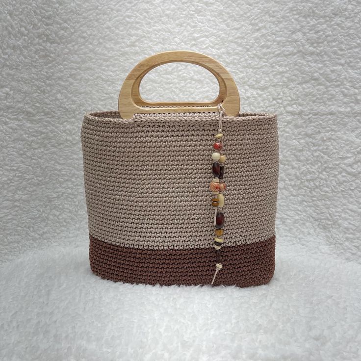 Handcrafted Minimalist Woven Shoulder Bag.     Dimensions: 11in wide x 9in high -  (28cm wide x 21 cm high)      Material: Natural cotton     Strap Length: 34in (87 cm) Care Instructions:     Gently clean with a toothbrush and mild soap or toothpaste     Avoid machine washing, bleaching, and ironing Boho Tote, Bag Handmade, Shoulder Tote, Mild Soap, Crochet Bag, Natural Cotton, Toothpaste, Care Instructions, Hand Weaving