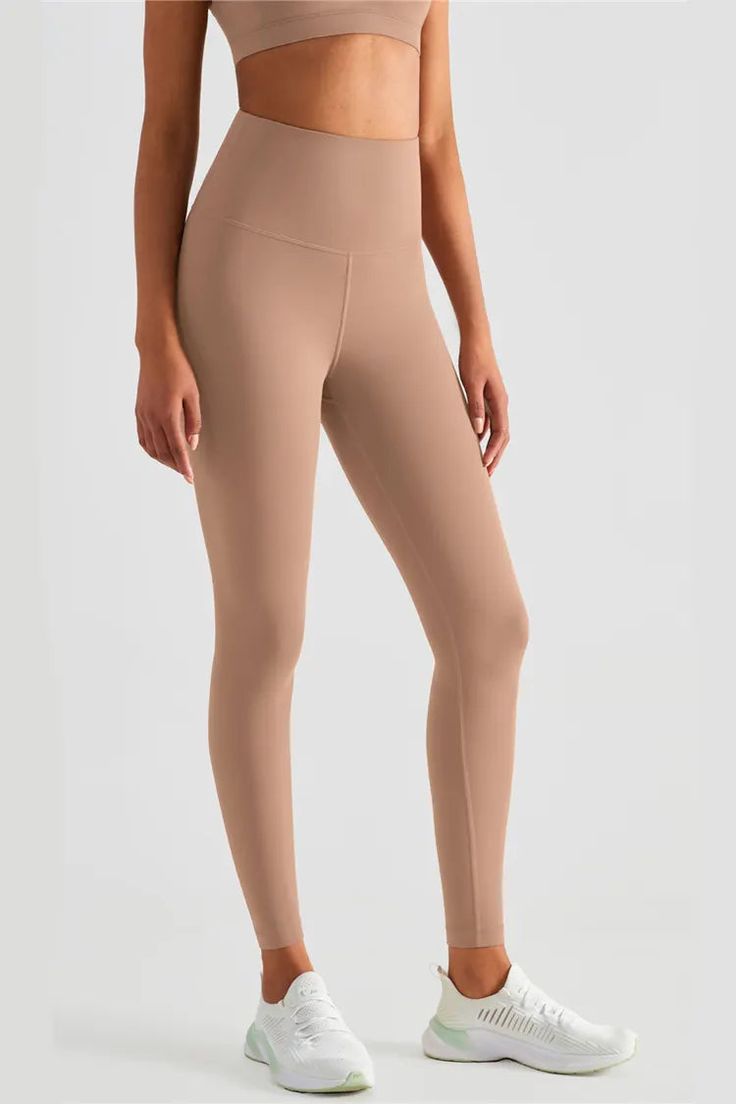 Yes, these Lexi Cacao High-Rise Tight Leggings are everything we love so far. Made of stretchy Lycra fabric, the high-waisted design highlights your figure. Pair these leggings with a crop top and sneakers for the ensemble we've always dreamed of.  Full Length: Approx 73cm Materials: 81% Nylon, 19% Lycra® elastane Stretch Type: Very Stretchy Gentle Dry Clean Only  Model is 5 ft 7 and wears size 6  Colour may vary due to lighting on images. The product images (without model) are closest to th Yoga Pants With Pockets, Hip Lifts, Lycra Fabric, Full Cup Bra, Fitness Studio, Black Khakis, Mens Sportswear, Clothes Organization, Bra Styles