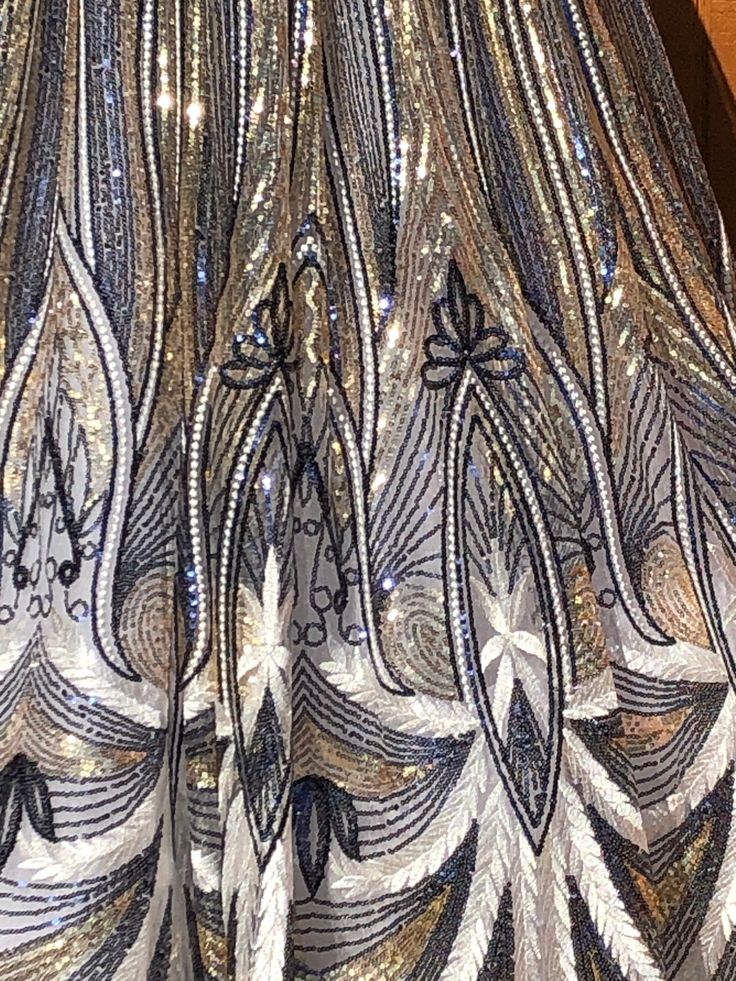 the back of a dress with sequins on it