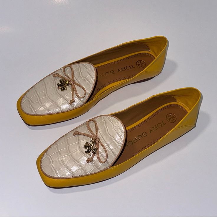 Elevate Your Shoe Game With These Chic Tory Burch Loafers. The Slip-On Design Features A Round Toe And A Collapsible Back For Versatile Wear. The Leather Upper, Lining, And Accents Including A Logo Charm Exude Luxury, While The Animal Print Pattern Adds A Touch Of Fun. Perfect For Any Occasion, These Flats Can Be Dressed Up For A Party, Worn Casually, Or Paired With Business Attire. The Cushioned Footbed Ensures Maximum Comfort, Making Them An Ideal Choice For All Seasons. Available In Size 5.5 Us/3 Uk/35.5 Eu, These Tory Burch Tory Charm Flats Are A Must-Have Addition To Your Wardrobe. New Without Box Outsole Has Remnants Of Sticker Adhesive Retail Price : $348 Guaranteed 100% Authentic Elegant Yellow Leather Loafers, Luxury Spring Loafers With Round Toe, Luxury Round Toe Loafers For Spring, Elegant Yellow Round Toe Loafers, Elegant Yellow Formal Loafers, Yellow Leather Loafers For Work, Elegant Yellow Loafers With Leather Sole, Luxury Spring Office Flats, Luxury Flat Loafers For Spring