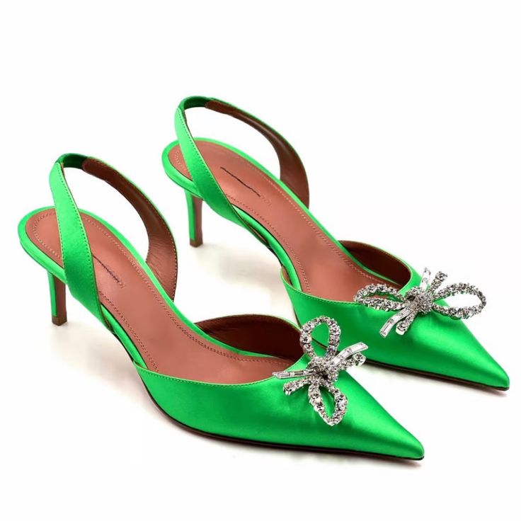 New Condition With Box! These Refined Point-Toe Slingbacks Are Adorned With A Pretty Crystal-Encrusted Bow At The Vamp. Satin Upper Point Toe Elasticized Slingback Strap Leather Lining Trim: Crystal Padded Insole Leather Sole Dust Bag Included Made In Italy Size Self-Covered Stiletto Heel, 2.25" (60mm) Luxury Green Pointed Toe Sandals, Green Pointed Toe Kitten Heels, Amina Muaddi Green Heels, Luxury Green Pointed Toe Heels, Amina Muaddi Shoes, Luxury Green Heels With 4-inch Heel, Amina Muaddi, The Vamps, Leather Heels