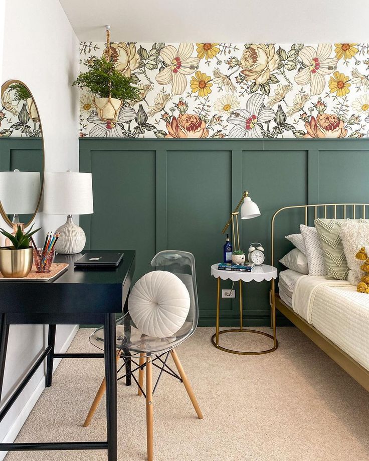 a bedroom with green walls and floral wallpaper