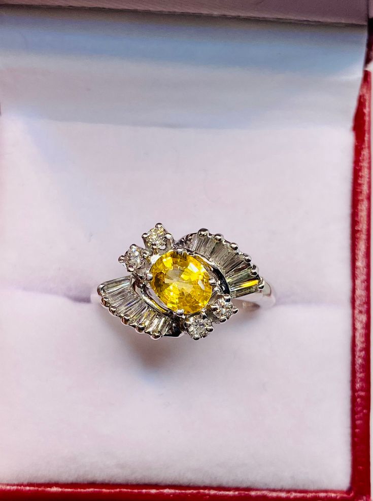 Stunning 18k White Gold Natural Yellow Sapphire Diamonds rounds and Baguette Ring: 100% Genuine Natural Sapphire: Sapphire 6.5x5.1 mm 0.90 CT Side Diamonds: 0.50 CT Color: G Clarity: VS2 Total ring weight: 4.9 GR 18k White Gold Ring sizing available free of charge For more information regarding this item feel free to reach me so I can accommodate your needs. Thank you Luxury Oval Rings With Baguette Diamonds, Oval Yellow Gold Ring With Baguette Diamonds, Elegant Yellow Diamond Ring Hallmarked, Oval Platinum Jewelry With Baguette Diamonds, Hallmarked Yellow Diamond Ring, Elegant Yellow Marquise Cut Ring, Elegant Yellow Marquise Cut Jewelry, Elegant Yellow Baguette Cut Diamond Ring, Oval Diamond Ring With Baguette Diamonds