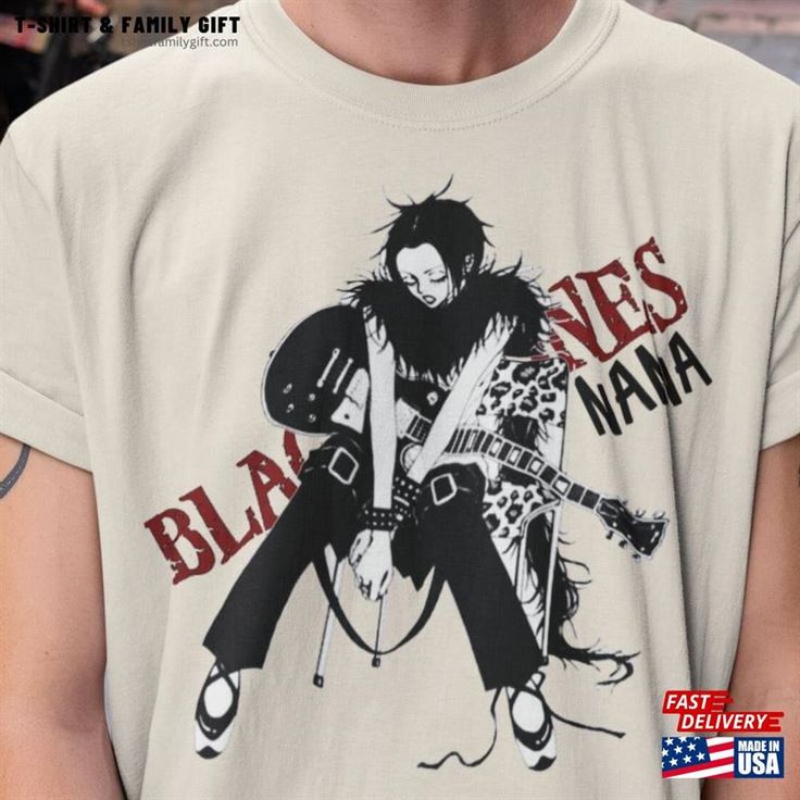 a man wearing a t - shirt with an image of a guitarist on it