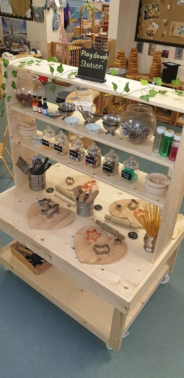 a display case filled with lots of different types of items on top of wooden shelves