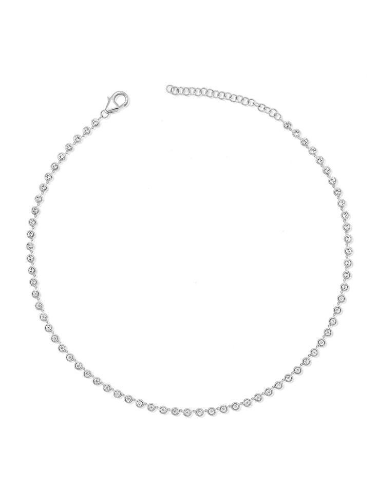 Add a touch of effortless sophistication to your style with our Endless Bezel Diamond Necklace. This stunning piece features a continuous line of radiant diamonds, each in a bezel setting that maximizes their sparkle. The miracle setting uses a faceted plate of gold around the diamond to enhance the diamond's appearance, creating an illusion of a larger stone. Whether you're dressing up for a special occasion or elevating your everyday look, this necklace brings timeless glamour to your jewelry Elegant Round Tennis Necklace With Rhinestones, Minimalist Diamond Necklace With Sparkling Stones, White Gold Diamond Necklace With Rhinestones, Elegant Round Bezel Setting Tennis Necklace, Elegant Bezel Set Tennis Necklace, Elegant Round Cut Rhinestone Necklace, Tennis Jewelry, Timeless Glamour, Bezel Necklace