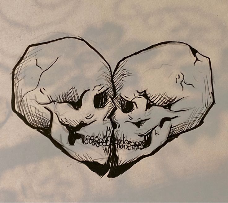 a drawing of two skulls in the shape of a heart