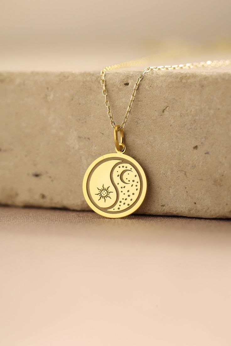 Gold Moon And Sun Pendant - Moon And Sun Gold Necklace ● Material of pendant: Solid Gold 14k ( REAL GOLD ) ● Metal Stamp: 14k ( REAL GOLD ) ● The pendant is available in 5 sizes: - 12,7 mm / 0.5 inches (Diameter) - 14,0 mm / 0,55 inches ( Diameter ) In the photos - 15,3 mm / 0.6 inches ( Diameter ) - 16,5 mm / 0,65 inches ( Diameter ) - 19,1 mm / 0,75 inches ( Diameter ) ( In the photos the size is 14mm / 0.55 inches Diameter ) ( Jump Ring inner diameter: 4 mm ) ● Material of chain: Solid gold 14k ( REAL GOLD ) It is thin and dainty and it is available in 4 sizes: - 40 cm / 15,75 inches ( Length ) - 45 cm / 17,72 inches ( Length ) In the photos - 50 cm / 19,68 inches ( Length ) - 55 cm / 21,65 inches ( Length ) ● Backside engraving is FREE ( Please use the personalization box for that.) ● Sun Moon Pendant, Dainty Yellow Gold Necklace With Sun And Moon Design, Crescent Coin Pendant Necklace As Gift, Celestial Round Necklaces For Anniversary, Celestial Round Necklace For Anniversary, Symbolic Round Charm Necklaces Tarnish Resistant, Yellow Gold Necklace With Moon Charm Gift, Symbolic 14k Gold Necklace With Moon Charm, Symbolic 14k Gold Jewelry With Moon Charm