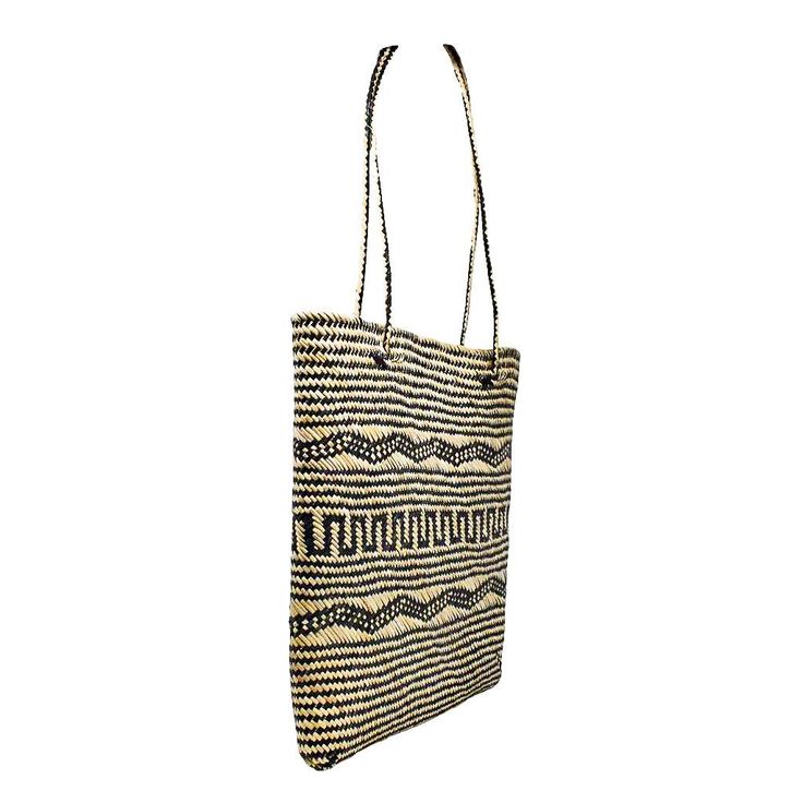 The perfect market tote, small beach bag, or everyday summer purse! 100% Handwoven Straw Tote Beautiful Black and Natural Motif Design Tote Body Height: 11" Bottom of Tote: Length 7" x Width 7" Top Opening of Tote: Length 9" x Width 8" Woven Handle Height: 11.5" Tall Total Tote Height, Body + Woven Handle: 21.5" Handmade by talented women artisans in Bali, and sustainably sourced with care All POPPY + SAGE totes come with our signature linen dust bag, a premium added touch to protect your tote w Artisan Bag, Summer Purse, Summer Purses, Straw Tote Bag, Handmade Tote, Tote Bags Handmade, Sustainable Fashion Brands, Straw Tote, Market Tote