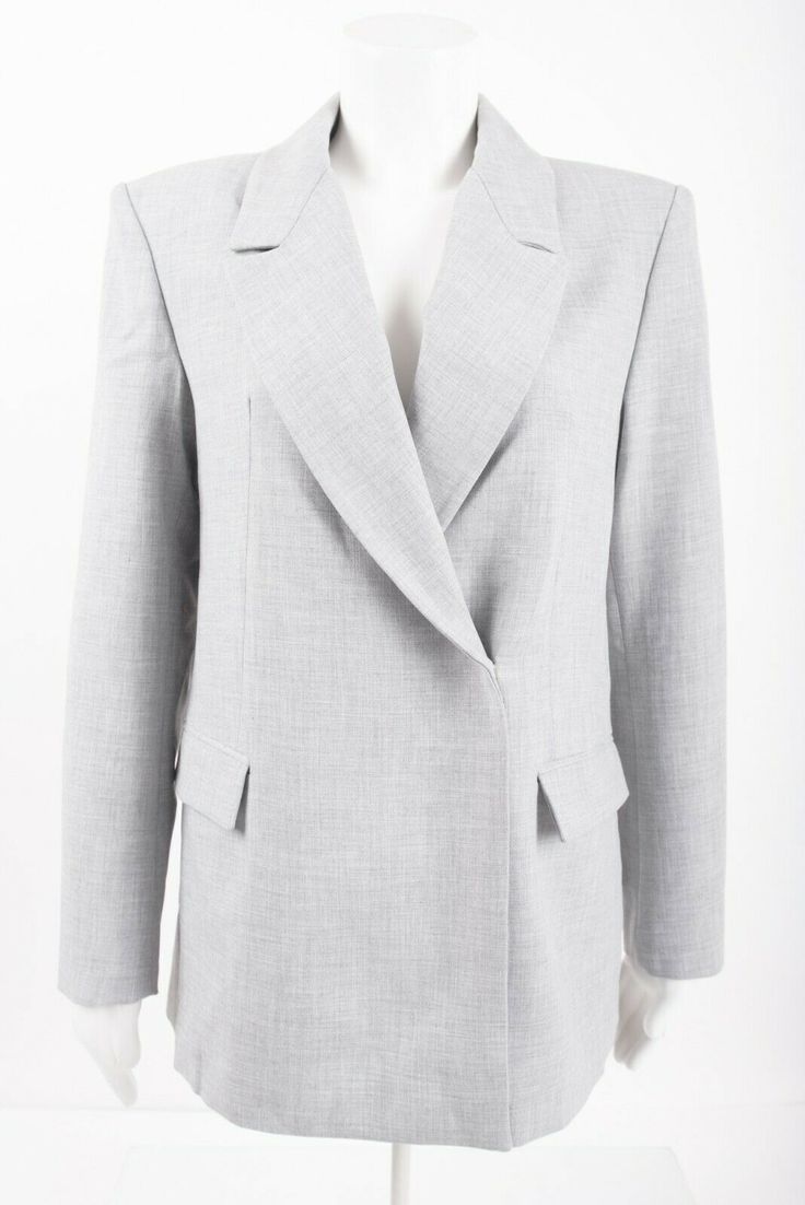 Zara Womans Oversized Suit Jacket Blazer Size XS  9144/282  Light Gray  NWT.  new with tags  Polyester/viscose/elastane.  Asymmetrical closure. Hook eye closure underarm to underarm - 18" sleeve from shoulder to cuff - 23.5" length from top back to bottom is - 27" Chic Asymmetrical Business Outerwear, Chic Asymmetrical Outerwear For Business, Asymmetrical Business Blazer For Fall, Modern Career Outerwear For Spring, Modern Spring Career Outerwear, Oversized Spring Business Blazer, Spring Oversized Business Blazer, Asymmetrical Blazer For Business In Spring, Asymmetrical Spring Business Blazer