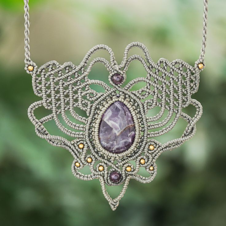 A rich, lilac-colored amethyst gemstone hangs at the center of this statement-making bohemian necklace designed by Thai artisan Kanjana. The artisan hand knots dark brown polyester cords in a sprawling pattern using traditional macrame techniques, then accents the design with tiny brass and amethyst beads. Macrame Techniques, Thailand Gifts, Macrame Pendant, Black Macrame, Macrame Earrings, Bohemian Necklace, Brass Necklace, Amethyst Beads, Blue Necklace