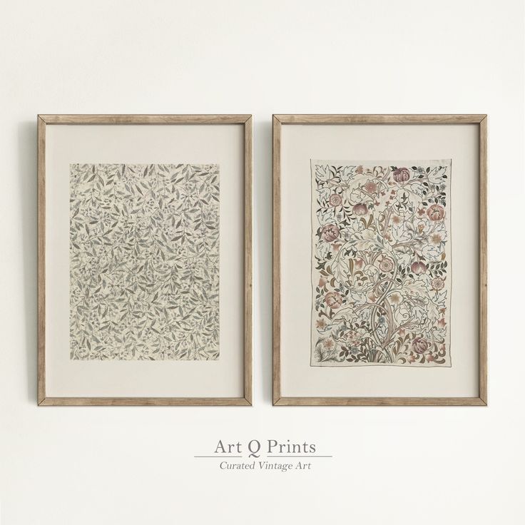 two framed art prints hanging on the wall next to each other, one with flowers and leaves