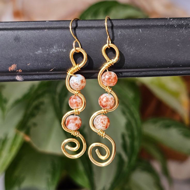 2" copper wire. wavy circle swirl earrings. meant for ear lobes. Dangle set. Perfect for gifts, personal use or events. Bohemian & hippie style. Classic design. Woman owned & crafted Bohemian Copper Wire Wrap Earrings, Bohemian Wrap Earrings With Copper Wire, Adjustable Wire Bohemian Earrings, Adjustable Bohemian Wire Earrings, Bohemian Nickel-free Wire Earrings, Bohemian Wrap Earrings With Copper Ear Wire, Handmade Bohemian Swirl Earrings, Bohemian Spiral Wrap Earrings With Ear Wire, Bohemian Gold Wrap Earrings With Copper Wire