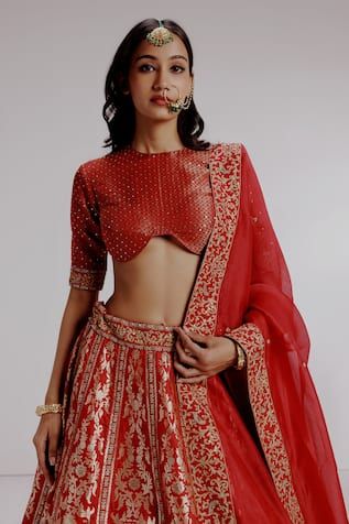 Red pure banarasi katan silk lehenga with bengal tiger, parrots and sequins embroidered motifs. Paired with pure satin silk geometrical checks embroidered blouse and pure silk organza dupatta. - Aza Fashions Ceremonial Dola Silk Lehenga For Eid, Festive Fitted Kundan Choli, Festive Meenakari Choli For Festivals, Fitted Red Set For Diwali, Fitted Red Sets For Diwali, Red Banarasi Silk Set With Resham Embroidery, Ceremonial Lehenga With Zari Work And Kundan, Designer Wear Meenakari Choli For Festivals, Navratri Fitted Meenakari Sharara